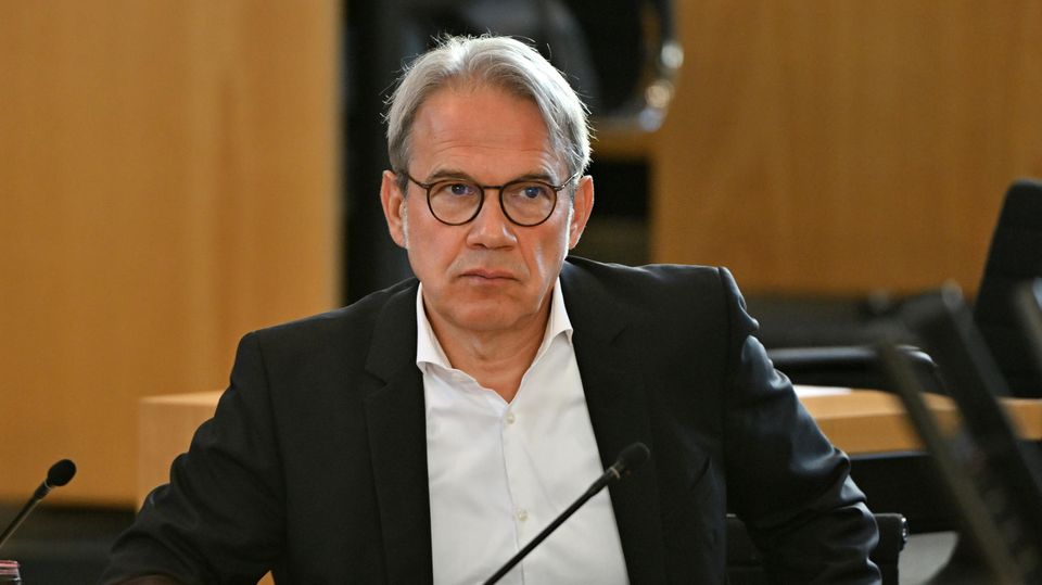 Thuringia's Interior Minister Georg Maier with a white shirt and black jacket