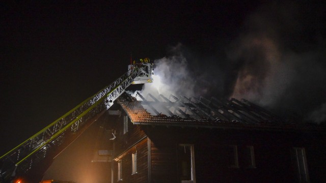 Storm in Bavaria: The fire brigade extinguishes the fire in a roof truss in Salzweg after a lightning strike.