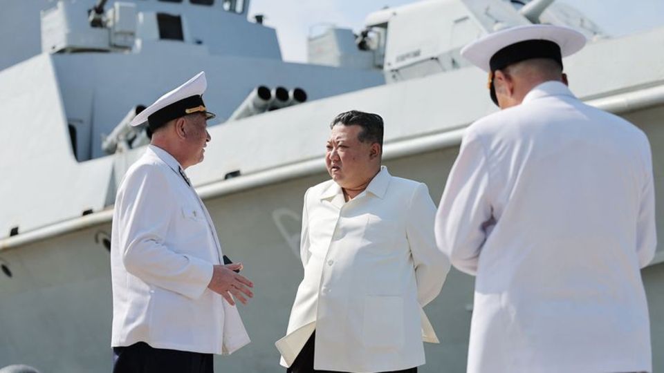 This undated photo is said to show North Korea's ruler Kim Jong Un (M) visiting a naval unit.  The recording was