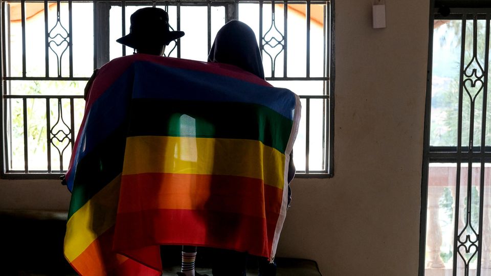 Uganda: A couple covers themselves with a Pride flag