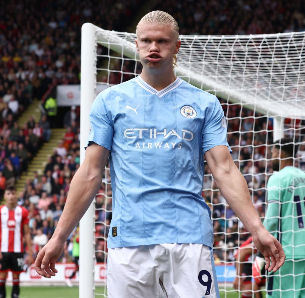TOPSHOT - Manchester City's Norwegian striker #09 Erling Haaland celebrates scoring the opening goal during the English Premier League football match between Sheffield United and Manchester City at Bramall Lane in Sheffield, northern England on August 27, 2023. (Photo by Darren Staples / AFP) / RESTRICTED TO EDITORIAL USE.  No use with unauthorized audio, video, data, fixture lists, club/league logos or 'live' services.  Online in-match use limited to 120 images.  An additional 40 images may be used in extra time.  No video emulation.  Social media in-match use limited to 120 images.  An additional 40 images may be used in extra time.  No use in betting publications, games or single club/league/player publications.  /