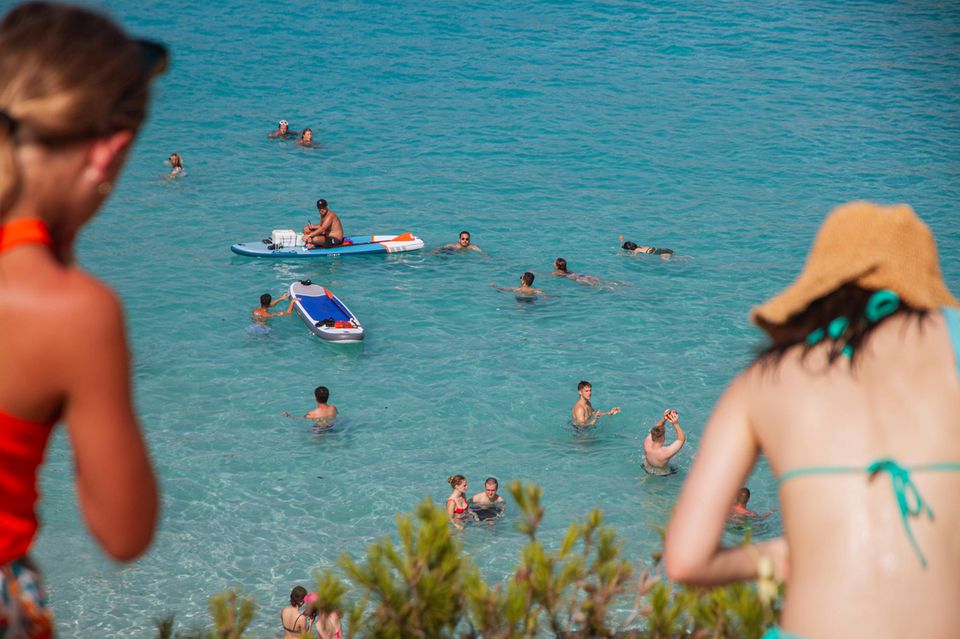 Bathers at Caló des Moro beach in Mallorca