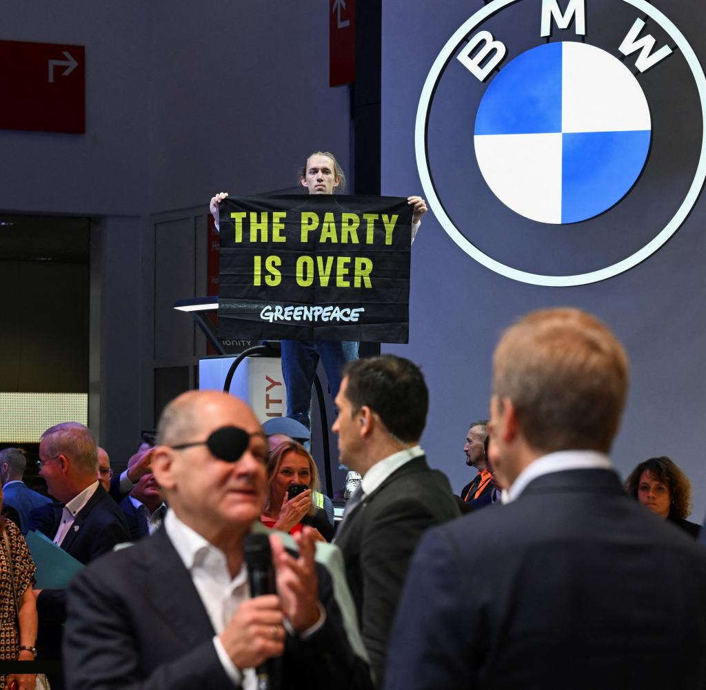 Greenpeace activists protested as Chancellor Olaf Scholz visited the BMW stand