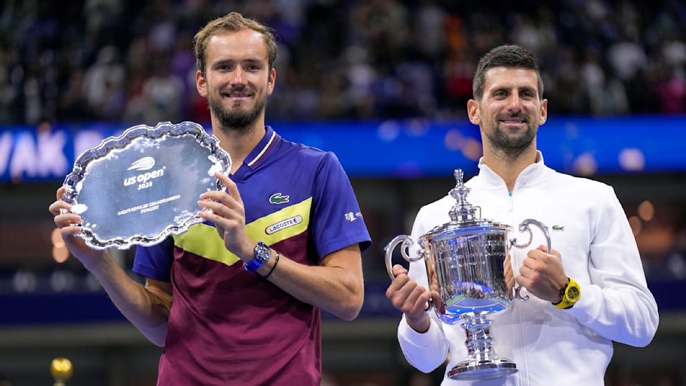 Fair loser: Daniil Medvedev with record champion Novak Djokovic