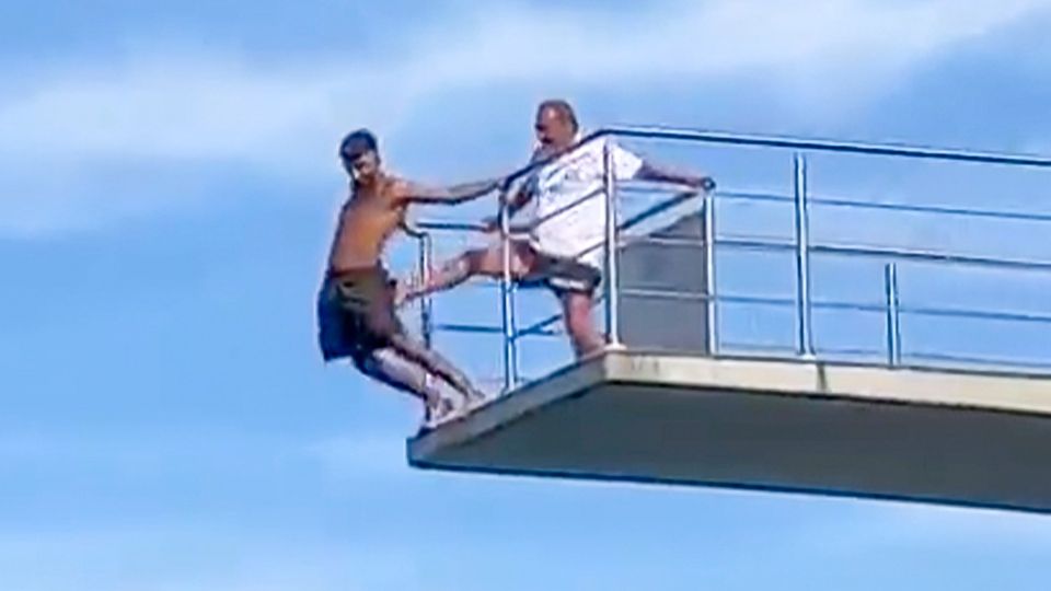 Lifeguard kicks young man from 10 meter tower