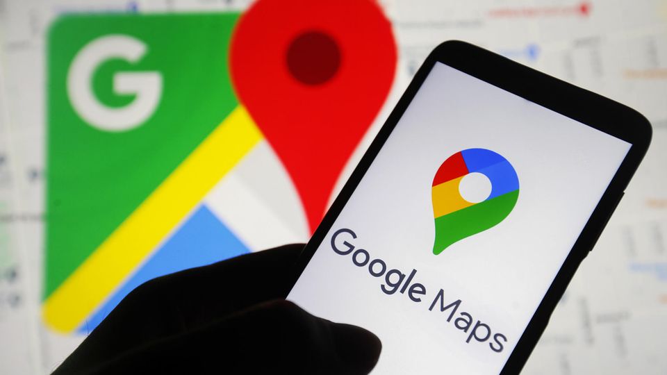 The Google Maps logo on the smartphone