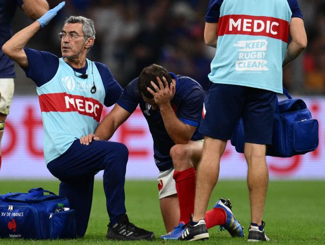 French scrum-half and captain Antoine Dupont receives medical treatment during the World Cup match against Namibia at the Stade-Vélodrome in Marseille on September 21, 2023.