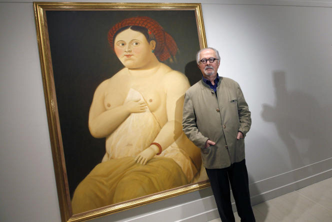 Fernando Botero poses in front of his painting “La Fornarina, after Raphael” at the Pera Museum in Istanbul on May 3, 2010.
