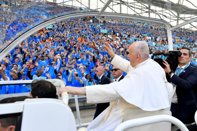 Pope Francis greets the crowd upon his arrival at the Stade-Vélodrome, where he celebrated a mass in front of nearly 60,000 people, Saturday September 23, 2023.