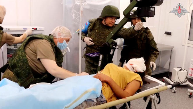An injured civilian helped by Russian peacekeepers following the launch of a military operation by Azerbaijani forces in Nagorno-Karabakh, in a screenshot from a video published on September 20, 2023.