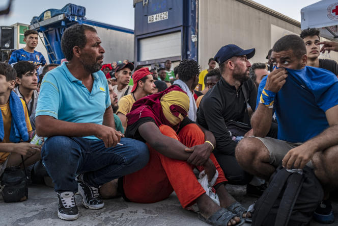 At the port of Lampedusa (Italy), migrants wait to be transferred to the Sicilian island, September 16, 2023.