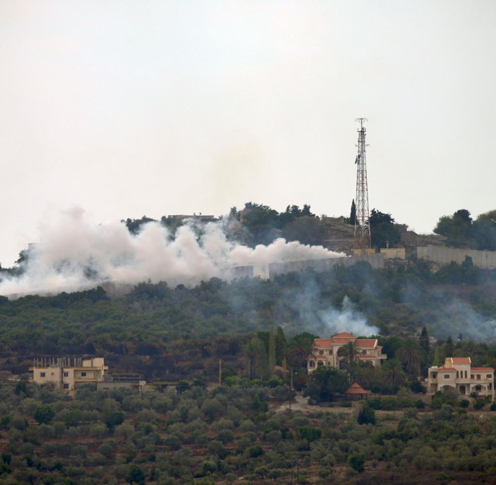Smoke rises after mutual shelling in the village of Duhaira (Lebanon) near the border with Israel