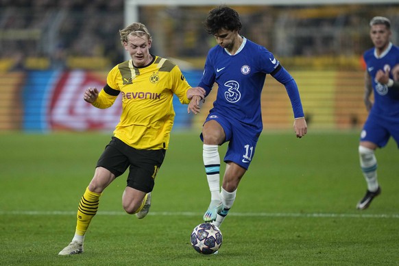 Chelsea's Joao Felix, right, challenges for the ball with Dortmund's Julian Brandt during the Champions League, round of 16, first leg soccer match between Borussia Dortmund and Chelsea FC i ...