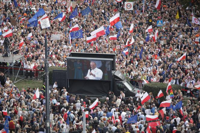 Polish opposition leader Donald Tusk appears on a video screen as his supporters attend the Million Hearts March, organized by opposition Civic Platform parties, two weeks before the elections legislative elections, in Warsaw, October 1, 2023.