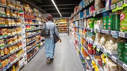 A woman goes shopping in a supermarket on October 9, 2023, in Paris.  (RICCARDO MILANI / HANS LUCAS / AFP)