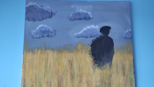 Art project about Ukraine: man in a wheat field at night.