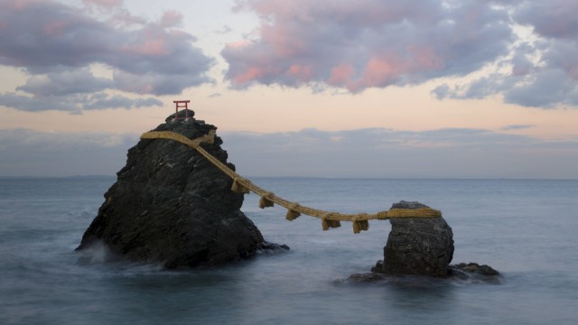 Vacation in Japan: Meoto-Iwa, the "Wedded Rocks": two rocks that are supposed to symbolize man and woman and are connected with sacred ribbons.  The rocks are located in Ise-Shima, in the region intended as an alternative destination.