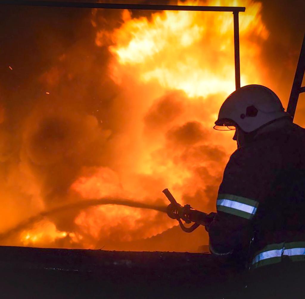 Firefighters extinguish a fire in Kharkiv after a Russian drone attack