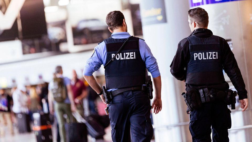Two police officers patrol Frankfurt Airport.  After the hostage-taking on the tarmac at the airport in Hamburg, a debate broke out about security at the airports.