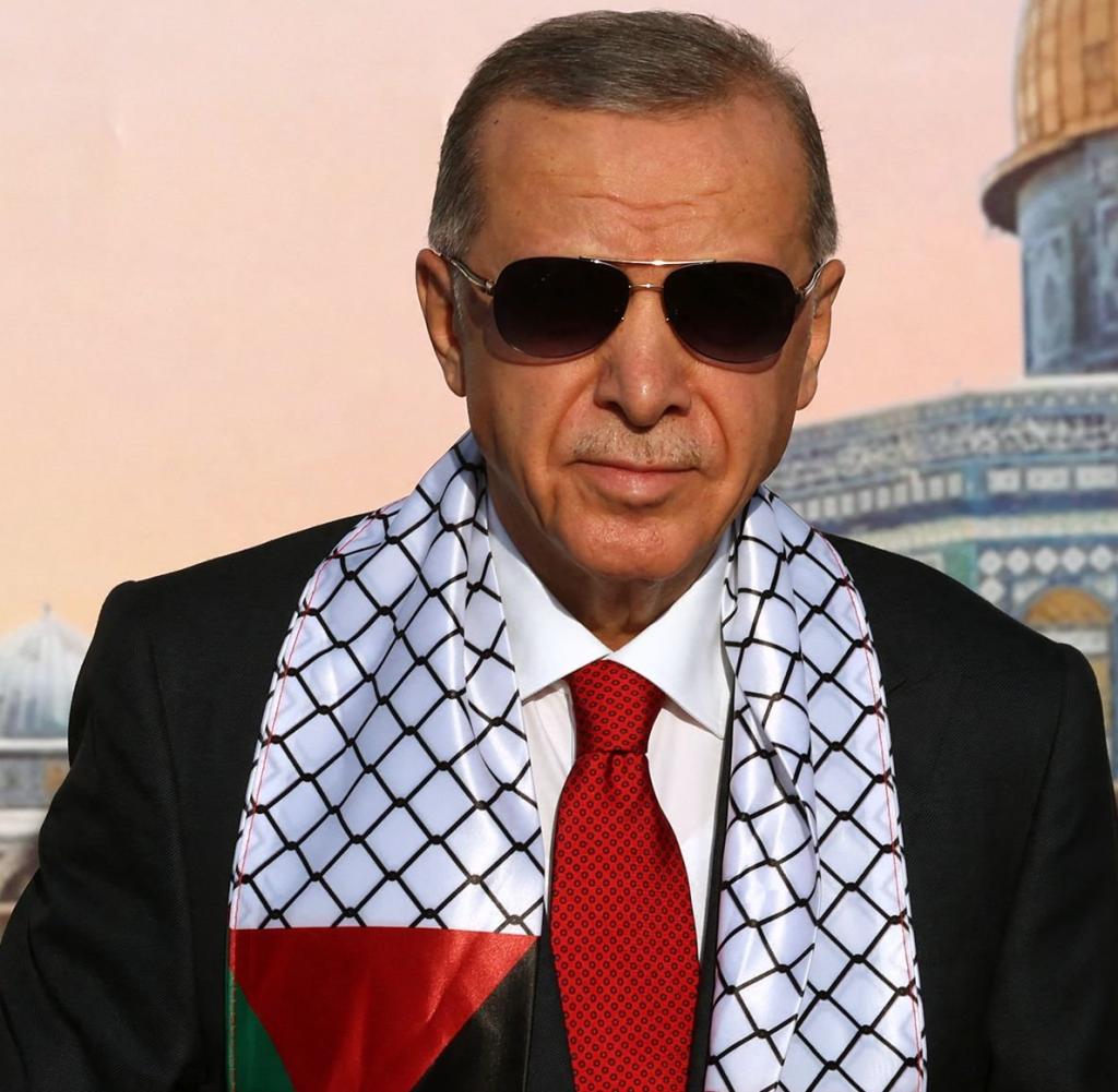 Turkish President Tayyip Erdogan in a scarf emblazoned with the Turkish and Palestinian flags