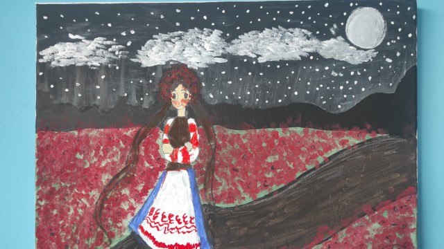 Art project about Ukraine: Woman in the Vyshyvanka national costume in a poppy field at night.
