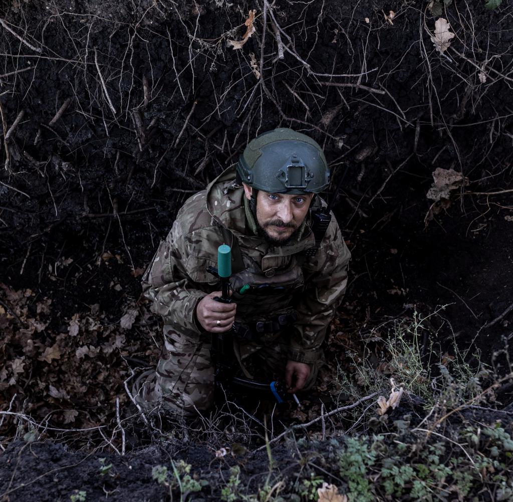 A Ukrainian soldier in a trench in Donetsk Oblast