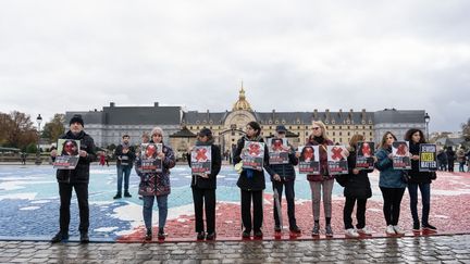 Participants in the march against anti-Semitism hold up portraits of Hamas hostages, November 12, 2023, in Paris.  (LAURE BOYER / HANS LUCAS / AFP)