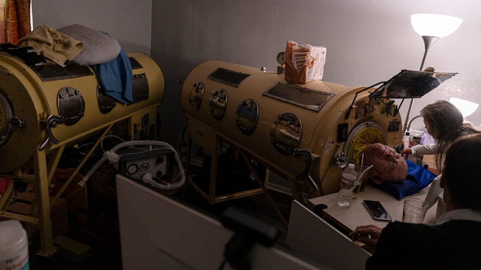 Paul needs help around the clock.  There is a second iron lung in the room - for spare parts