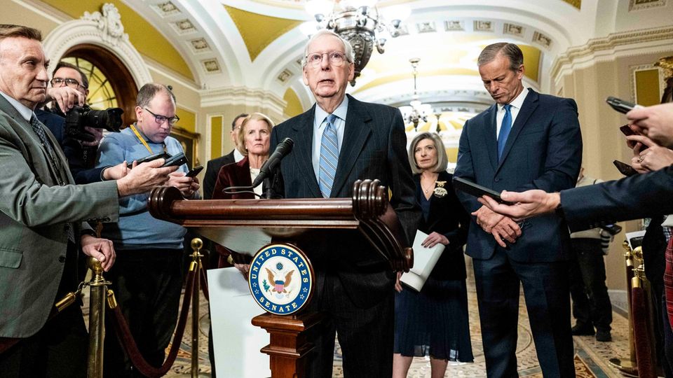 Republican Senate Minority Leader Mitch McConnell speaks to reporters
