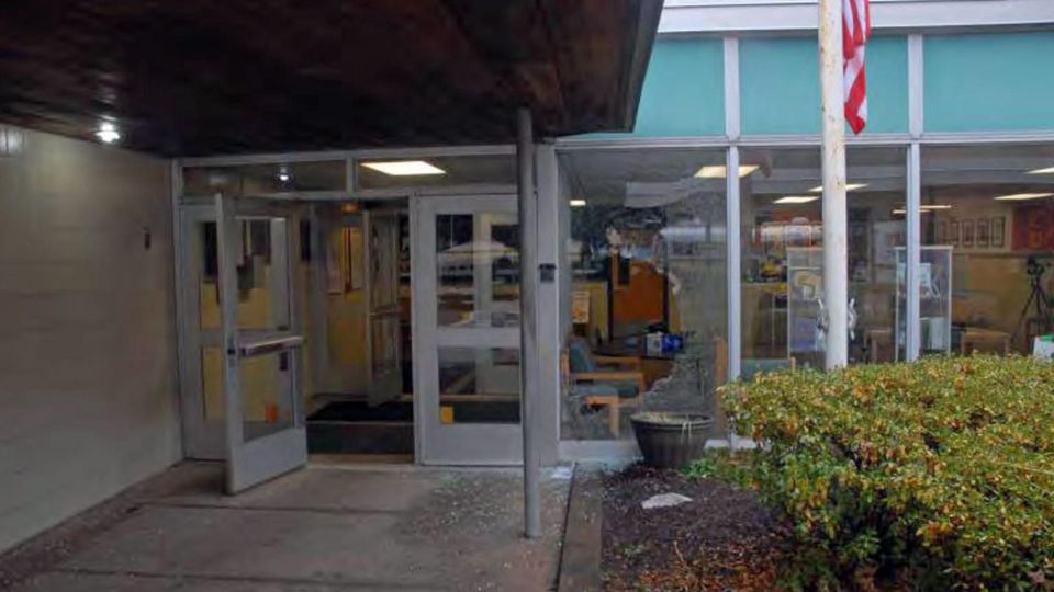 The broken front door of Sandy Hook Elementary School