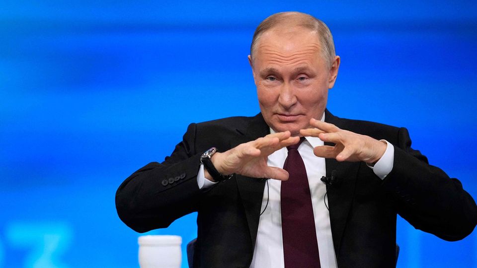 Russian President Vladimir Putin gestures