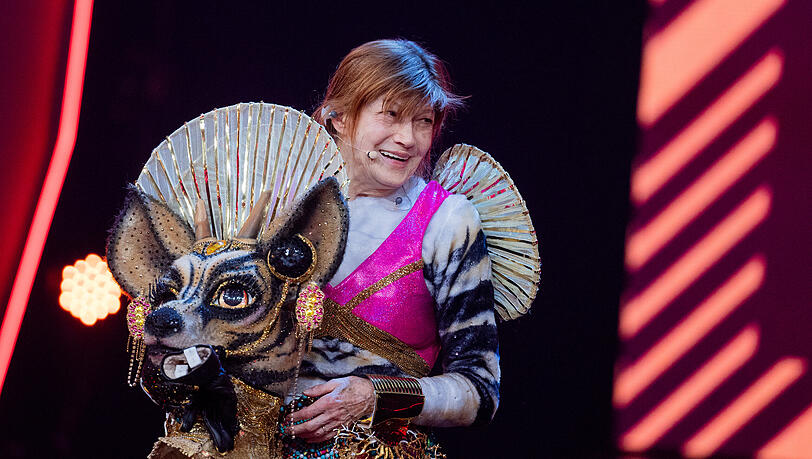 Katja Ebstein, singer and actress, stands as an unmasked figure "The okapi" on the Prosieben show "The Masked Singer" on stage.