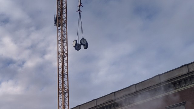Central station: There it flies: The station clock is being transported away.