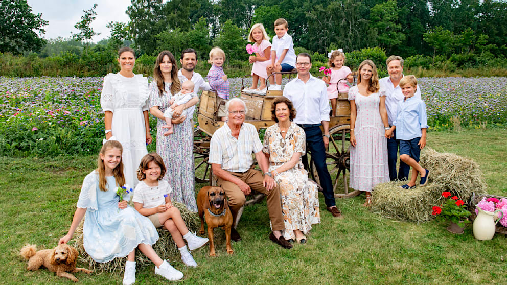 Queen Silvia and King Carl Gustaf with their three children, their spouses and a total of eight grandchildren and two dogs at Solliden Castle in Borgholm