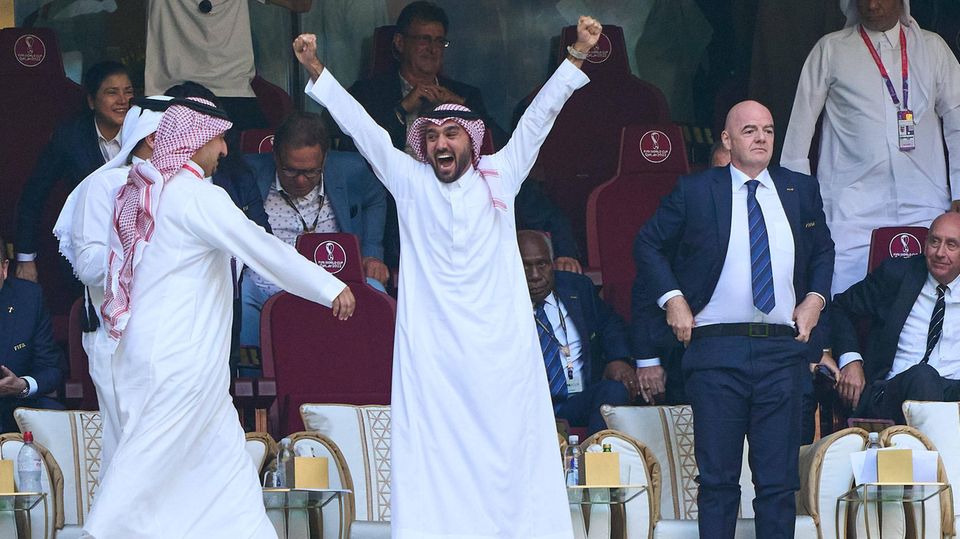Saudi Arabia's Crown Prince Mohammed bin Salman celebrates his country's victory over Argentina at the 2022 World Cup, with Fifa President Gianni Infantino next to him