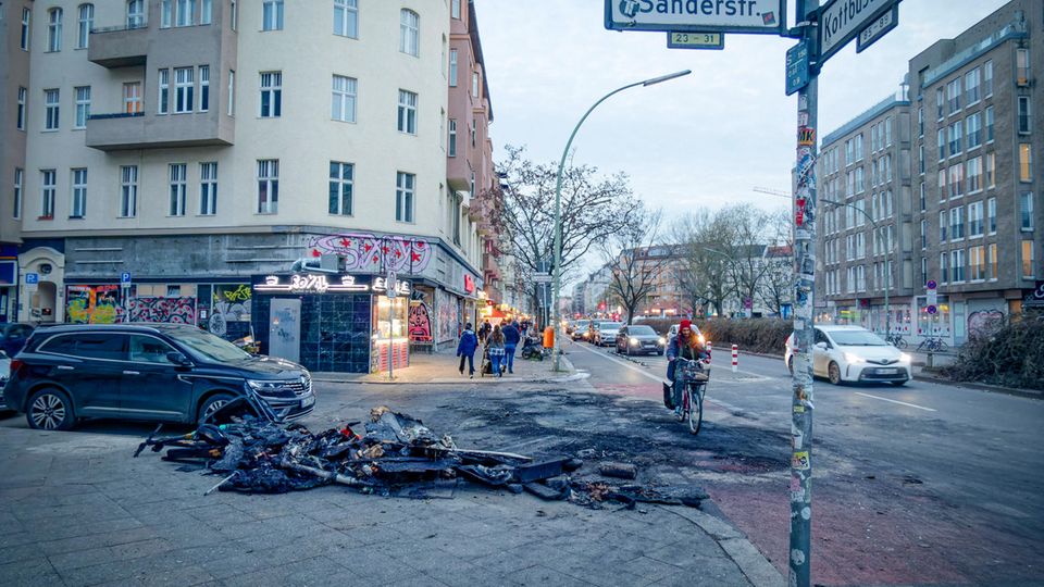 Remains of burned garbage cans and e-scooters after riots on New Year's Eve 2022