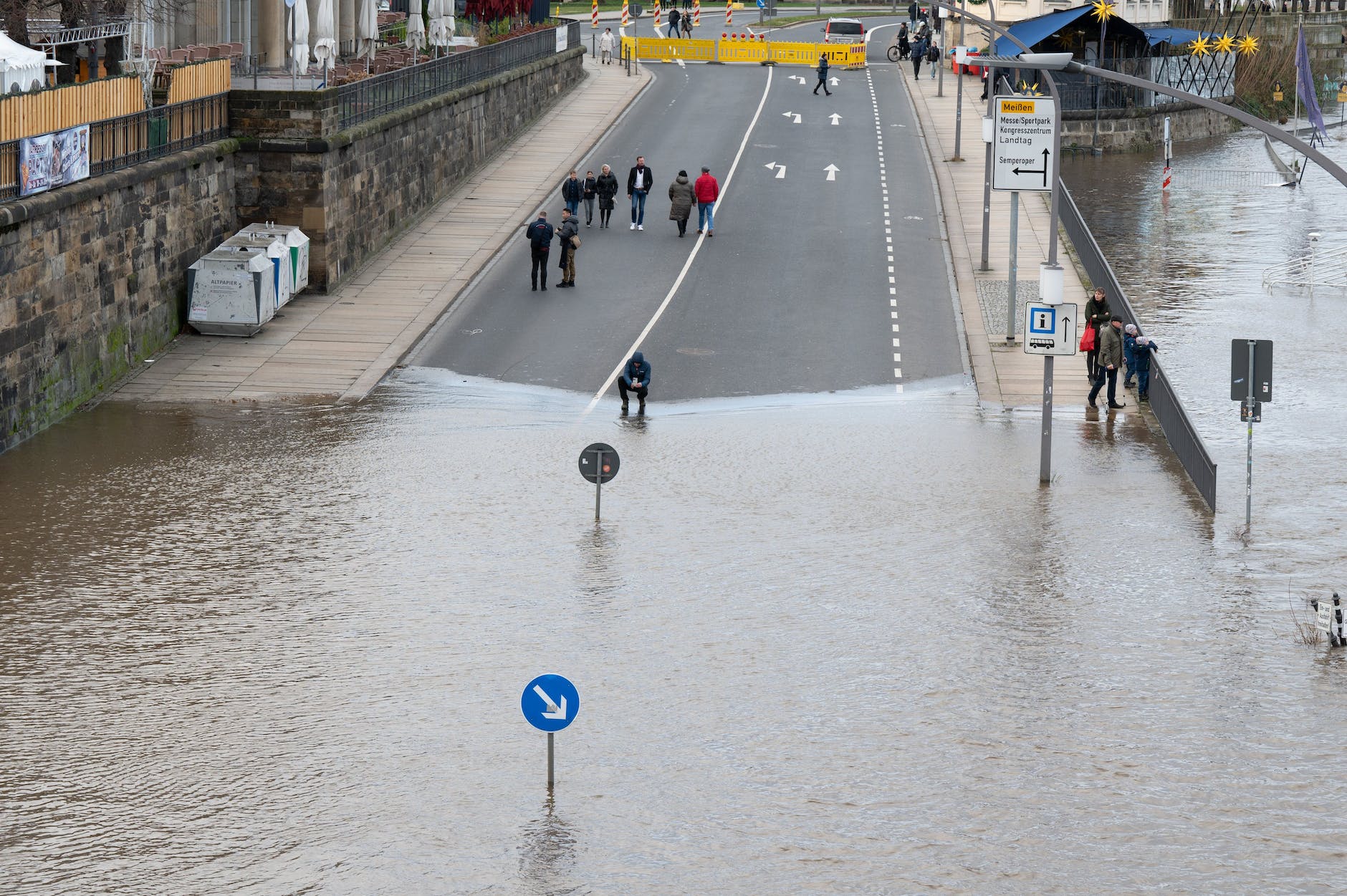 Saxony, Dresden: The floodwaters of the Elbe surround a traffic sign on the Terrassenufer.