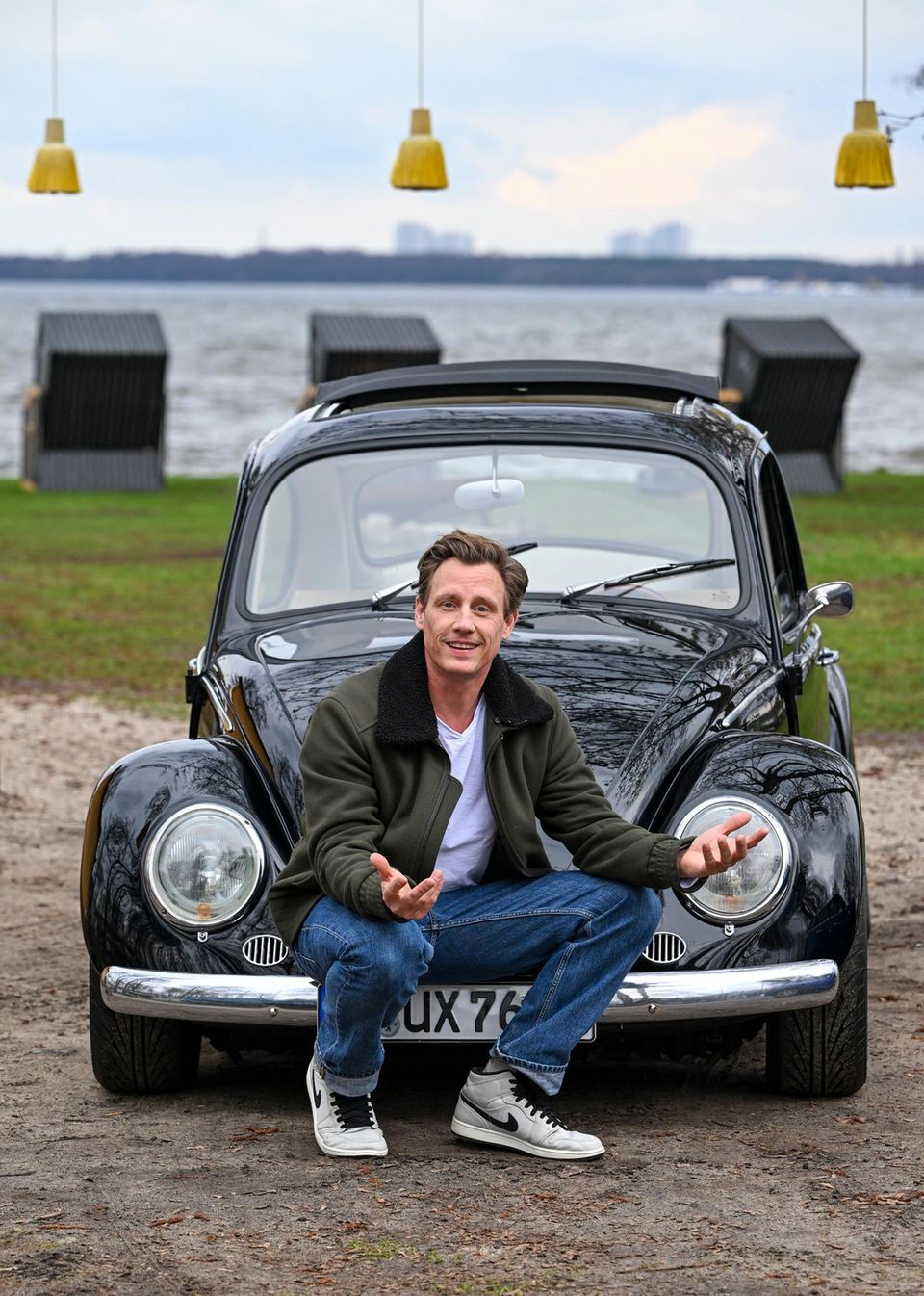 Patrick Kalupa in front of his VW Beetle