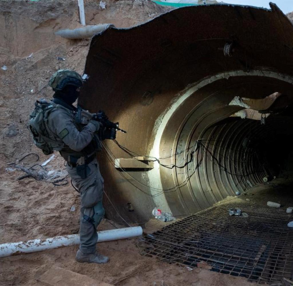(231218) -- GAZA, Dec. 18, 2023 (Xinhua) -- This photo released by the Israel Defense Forces (IDF) on Dec. 17, 2023 shows Israeli soldiers examining a large underground Hamas tunnel system uncovered in the Gaza Strip. The IDF said it has uncovered the largest underground Hamas tunnel system in Gaza so far. The system splits into branches of tunnels, spans over more than 4 km and reaches 400 meters from the Erez crossing, a passageway between Gaza and Israel. (Xinhua)