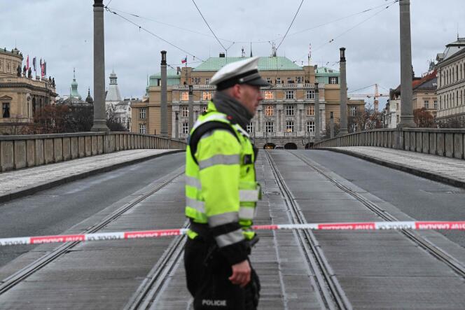 A police officer near the evacuated area after the killing at Prague University on December 21 in the Czech Republic.