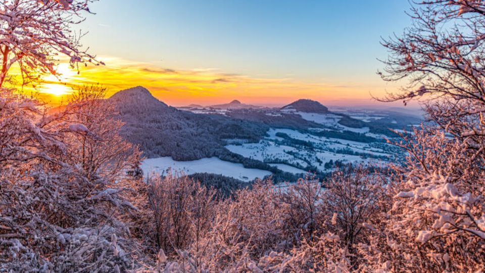 The sun sets behind the three Kaiserbergs near Hornberg in Baden-Württemberg.  Welcome to winter wonderland!