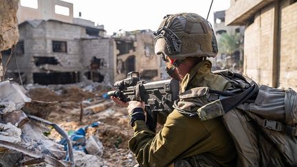 An Israeli soldier in the Gaza Strip, December 22, 2023. (ISRAELI ARMY / AFP)