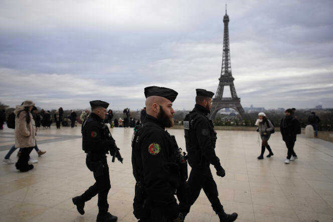 Police officers on Place du Trocadéro, near the Eiffel Tower, December 3, 2023.