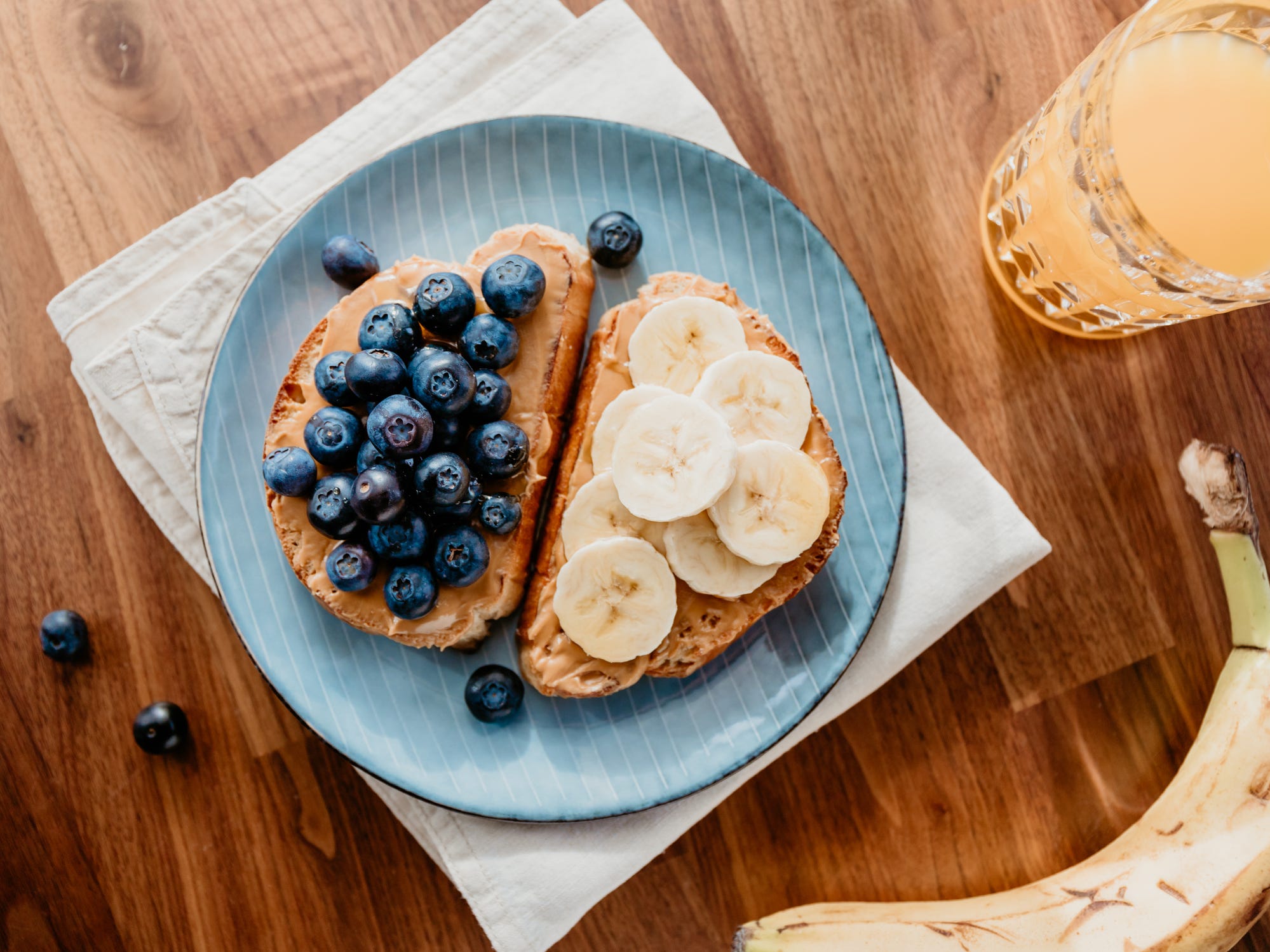 Peanut butter and fruit on toast is a quick breakfast.
