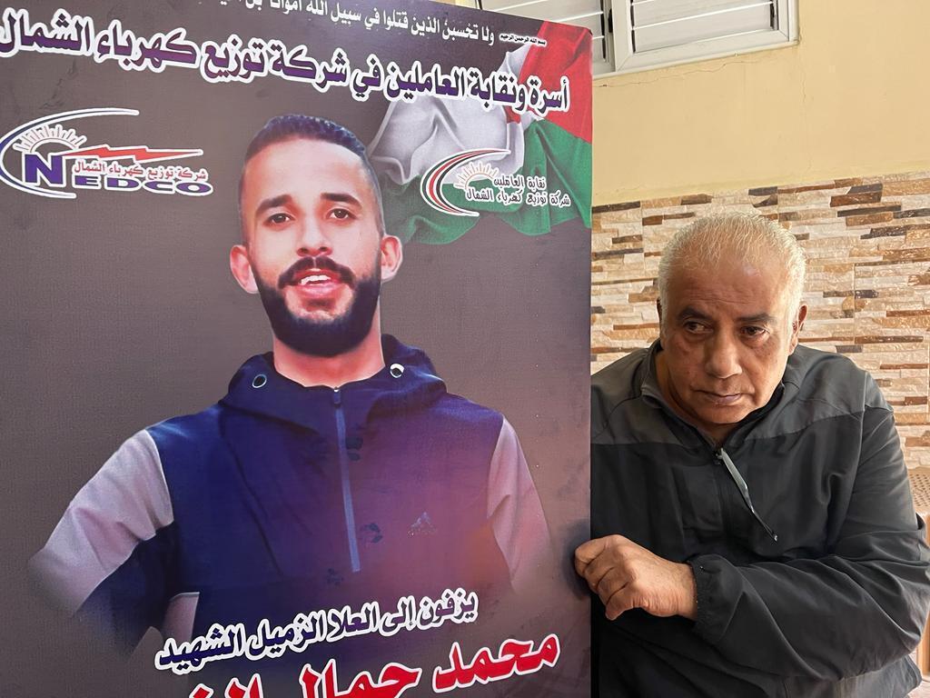 On January 7, 202, Jamal Zubeidi holds the portrait of his son Mohammed, killed by the Israeli army in the Jenin refugee camp on November 29, 2023.