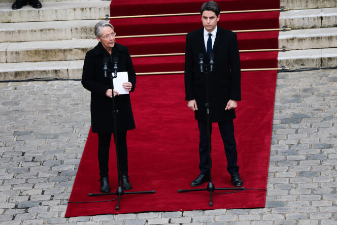 The former prime minister reads a speech alongside Gabriel Attal, her successor, at the Matignon hotel, in Paris, January 9, 2024.