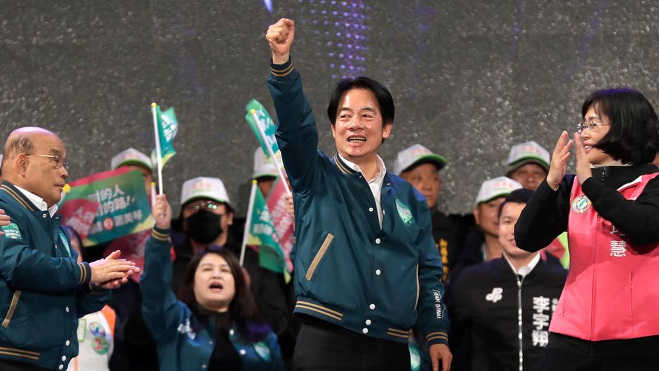 William Lai cheers during a campaign rally