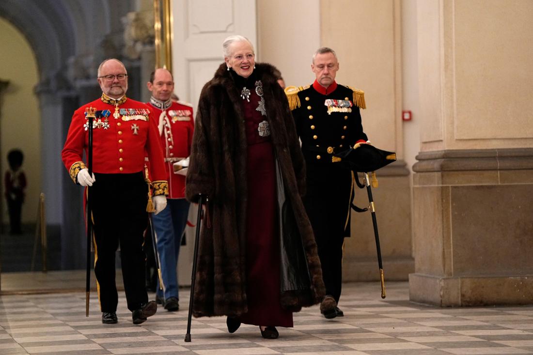 Queen Margrethe walks on a stick to the traditional New Year celebrations on day four after the announcement of her abdication.