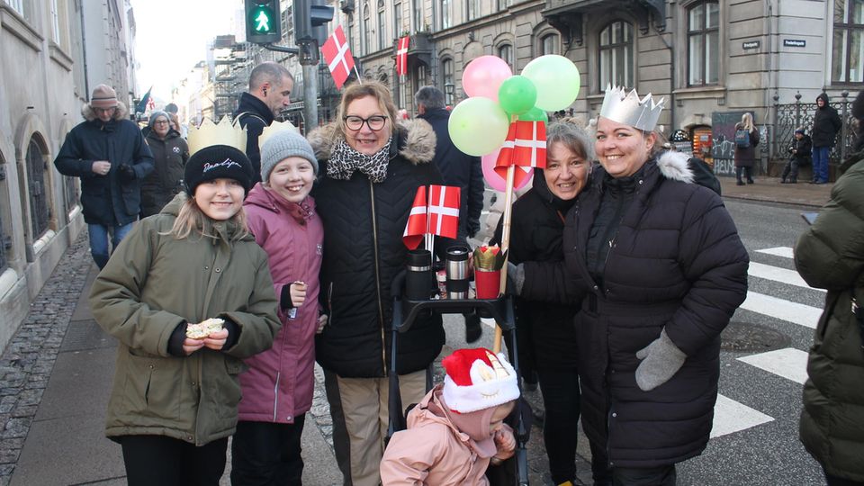 Family with flags and balloons in Copenhagen