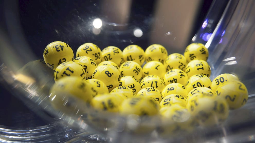 The lottery balls promise wealth to a few